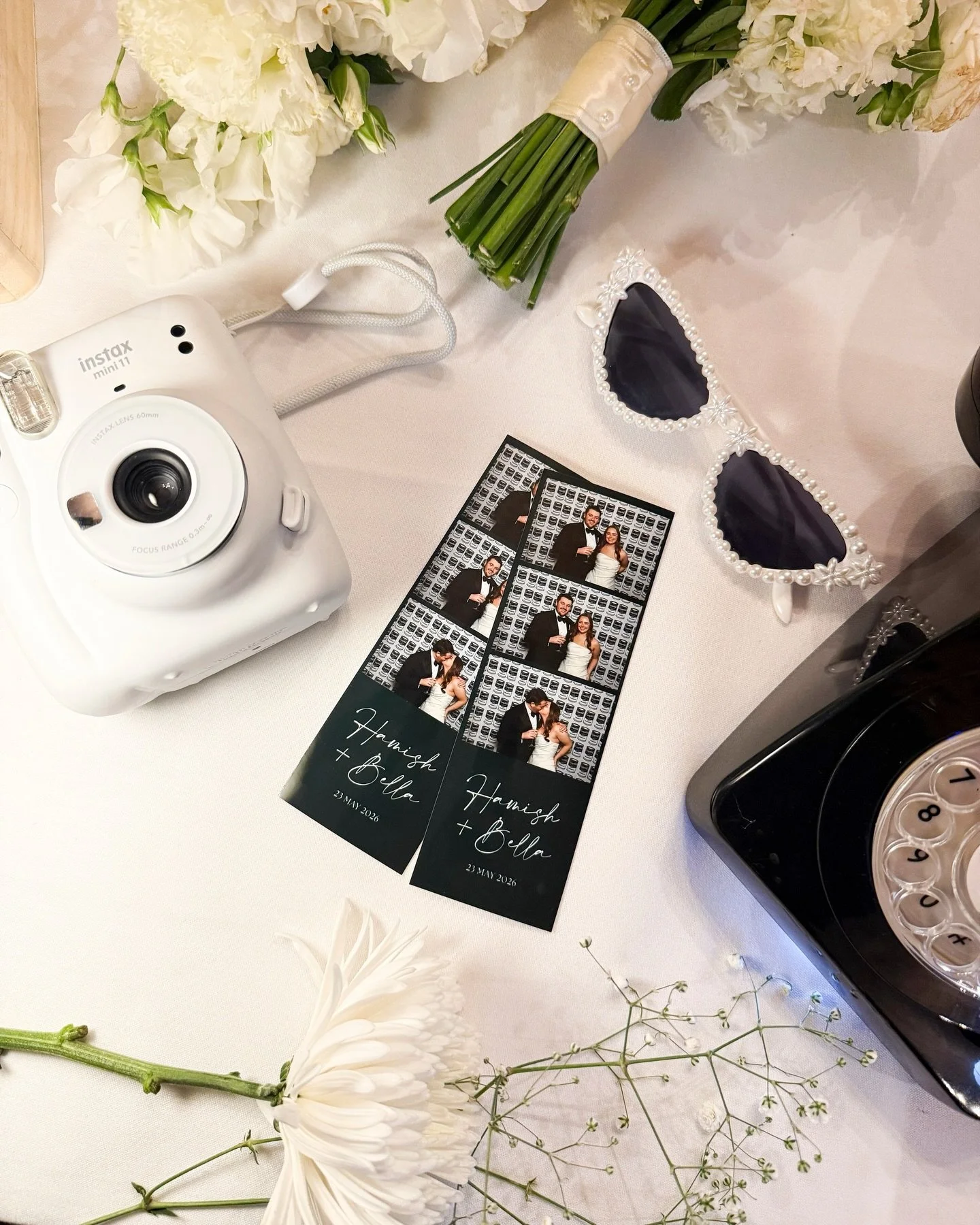 The details that make it more than just a photo booth. Bella and Hamish had the full setup &mdash; memory box filling up with prints all night, an audio guest book for guests to leave their messages, and a custom print design that tied everything bac