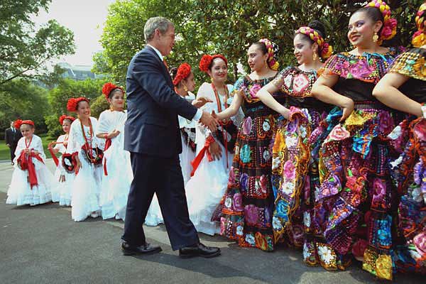 President George W. Bush greeting Cinco de Mayo dancers, via Wikipedia .