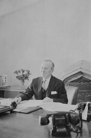 Lester Pearson occupying his new office after his election win in 1963, via Library and Archives Canada .