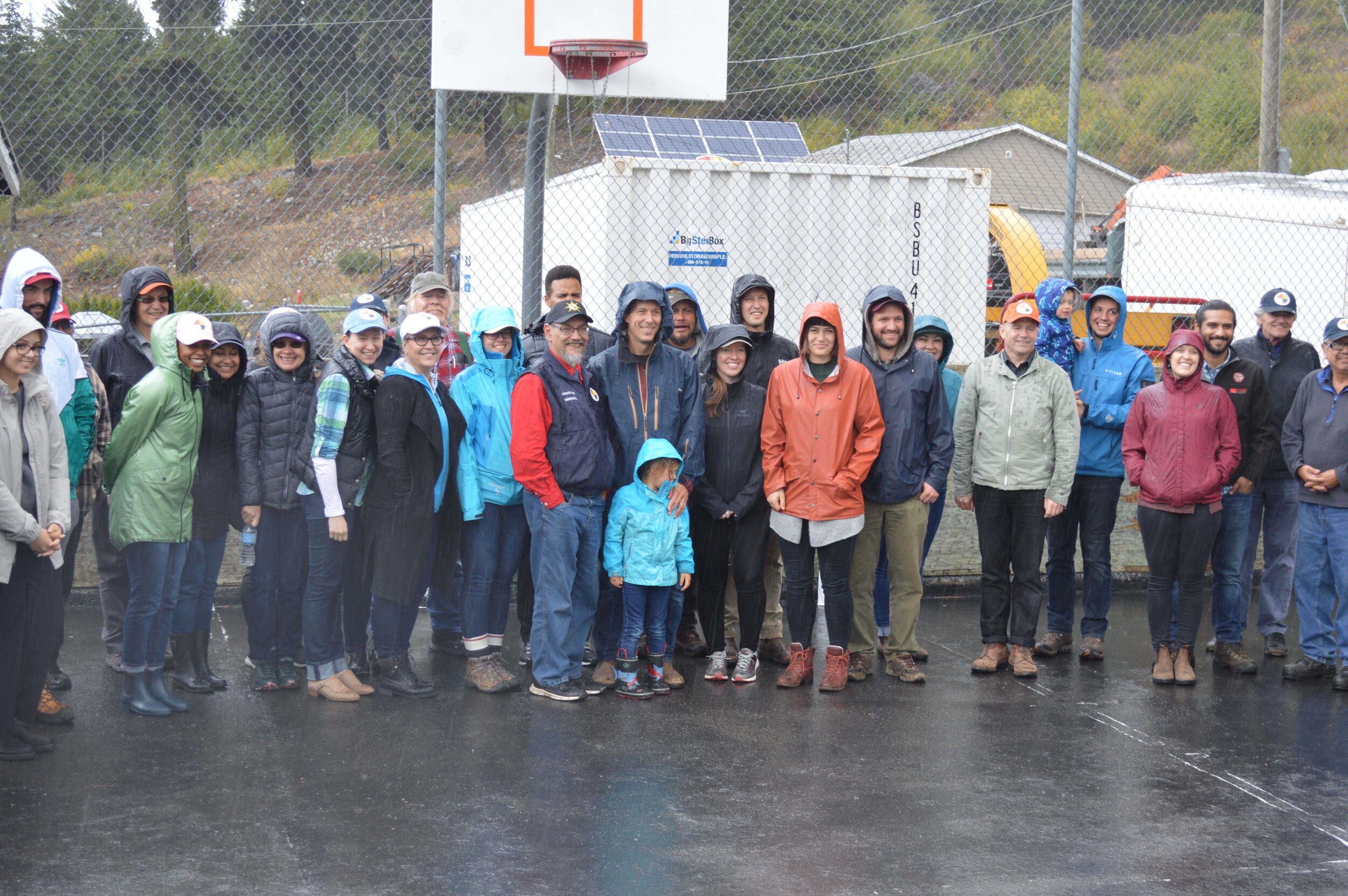 Group of People Standing in a Basketball Court