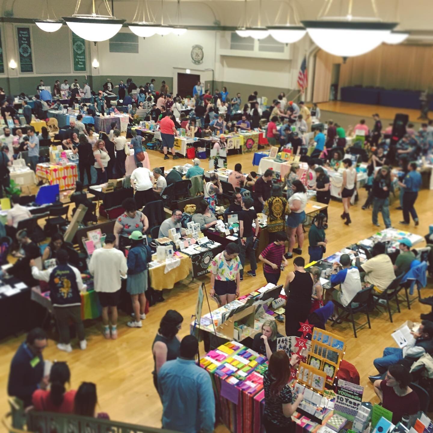 #CZF2020 is happening virtually today (check out @chicagozinefest for more info) and I wanted to make a #throwback post of last CZF!  Pics 1 is the venue at the beginning of #CZF2019, and pic 2 is my table set up last year.
📕📘📙
I&rsquo;ve been luc