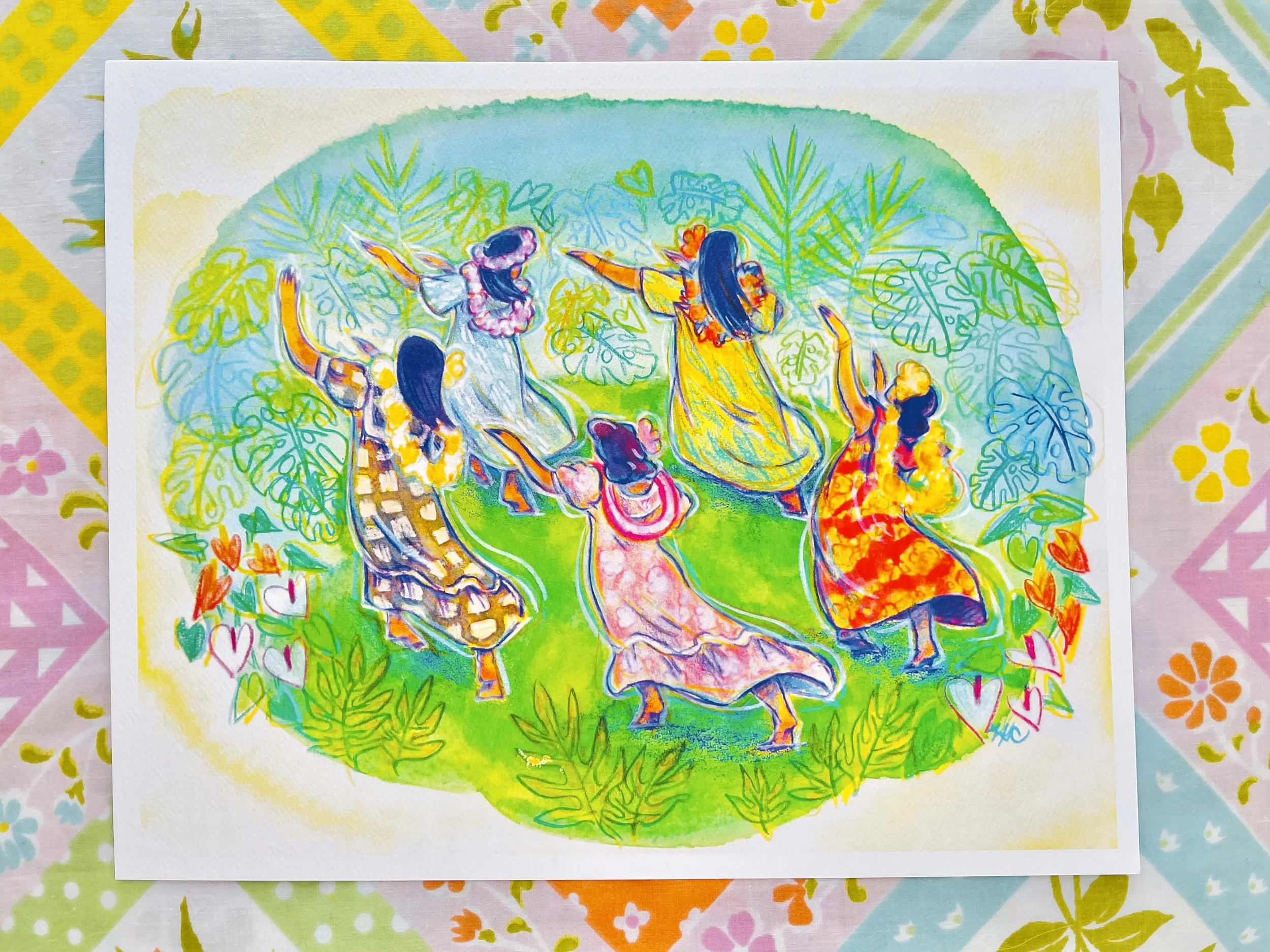 Photo of art print on pastel floral fabric.  Print is a vibrant watercolor & colored pencil illustration of 5 hula dancers facing away with long dark hair & tan skin wearing colorful mu‘umu‘u & lei.