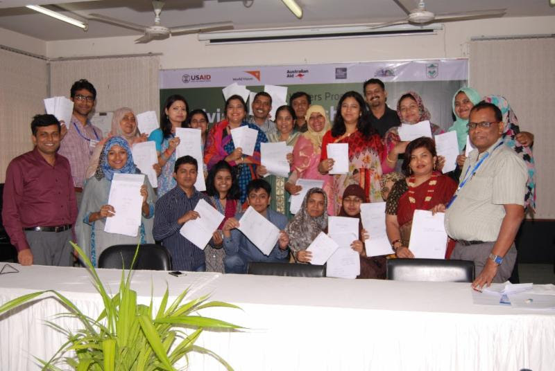 Participants in the Enabling Writers workshop in Bangladesh display their creations.