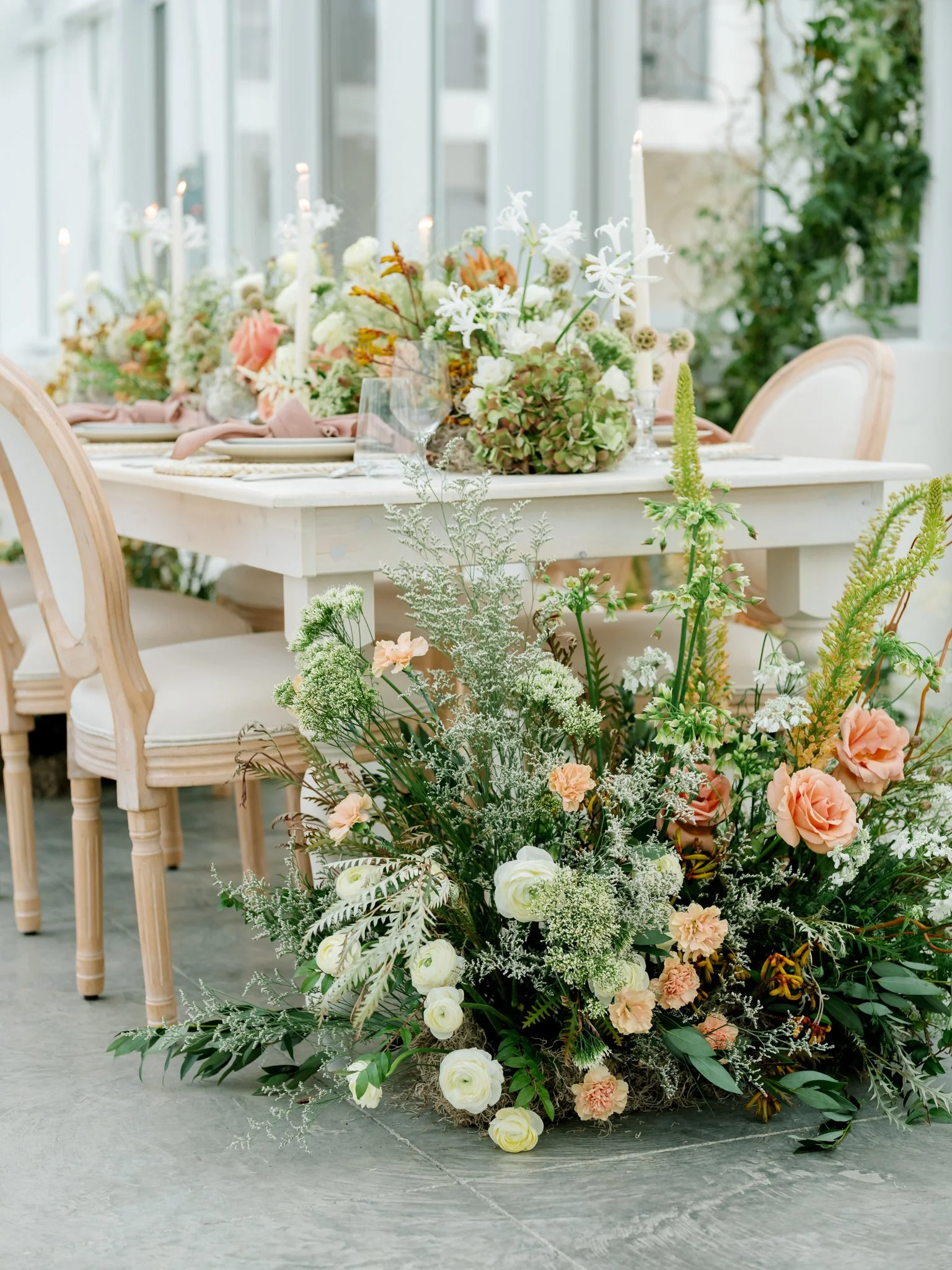 A floral decorated table scape during a wedding at Greenhouse on Harvard near Spokane, Washington