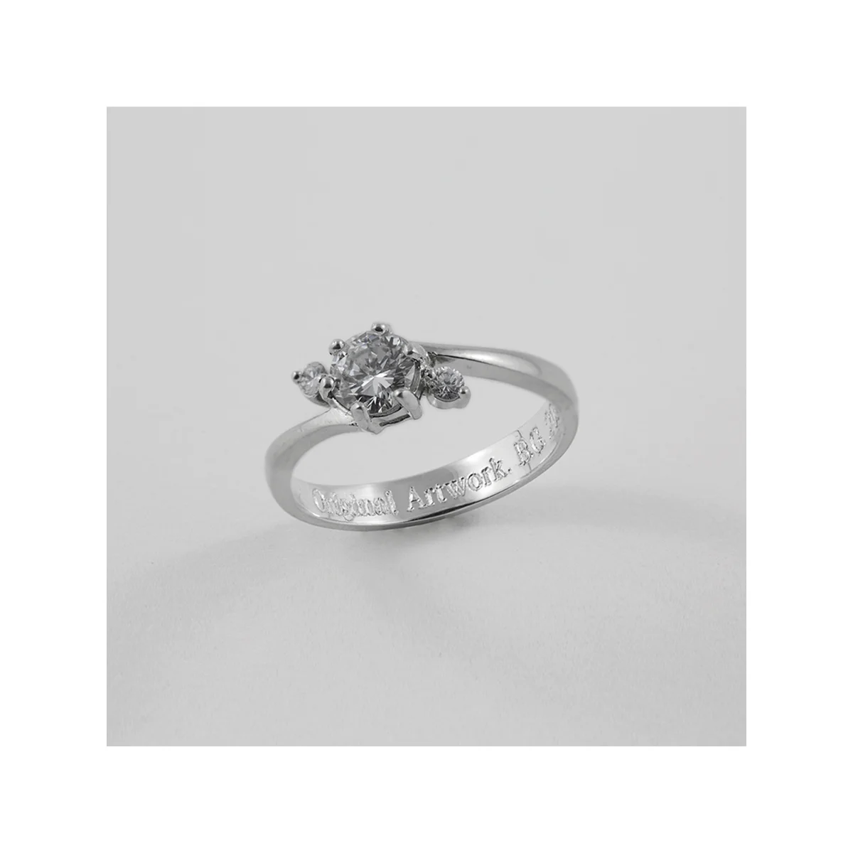    Diamond Ring   (after) Detail 2016 Inkjet on archival paper 4” x 4”  Photo of the returned silver ring with diamond and engraved authenticaton. 