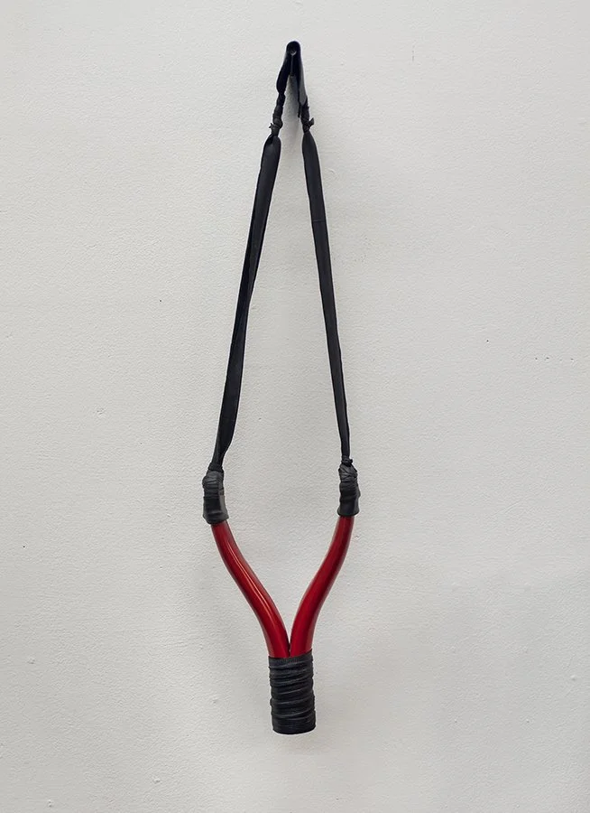    In Advance of the Broken Head  ) 2016 steel, leather and rubber 21” x 5.5” x 1” 