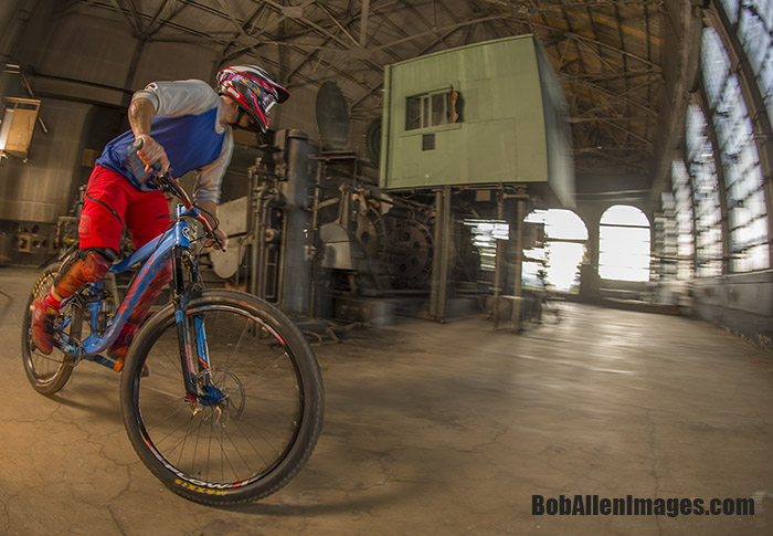  John Faunce pre-rides the Evel Urban Downhill course through The Con mine's motor room. 