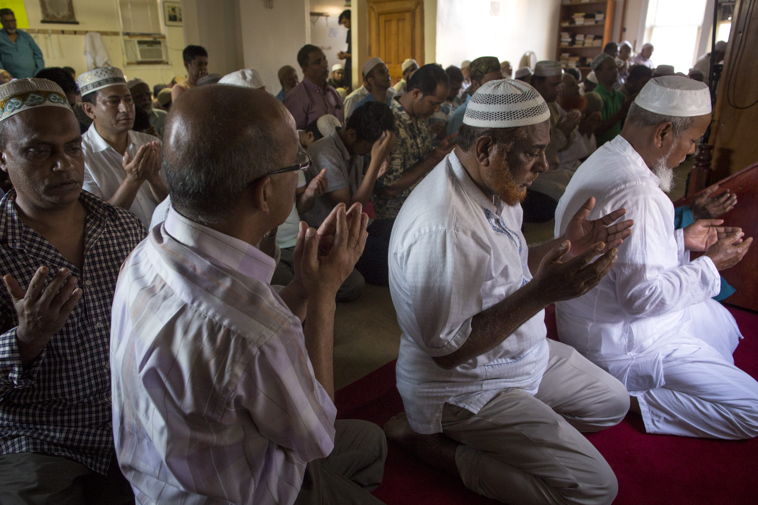  A prayer service hours after the fatal shooting of an imam and his assistant. Queens, NY 