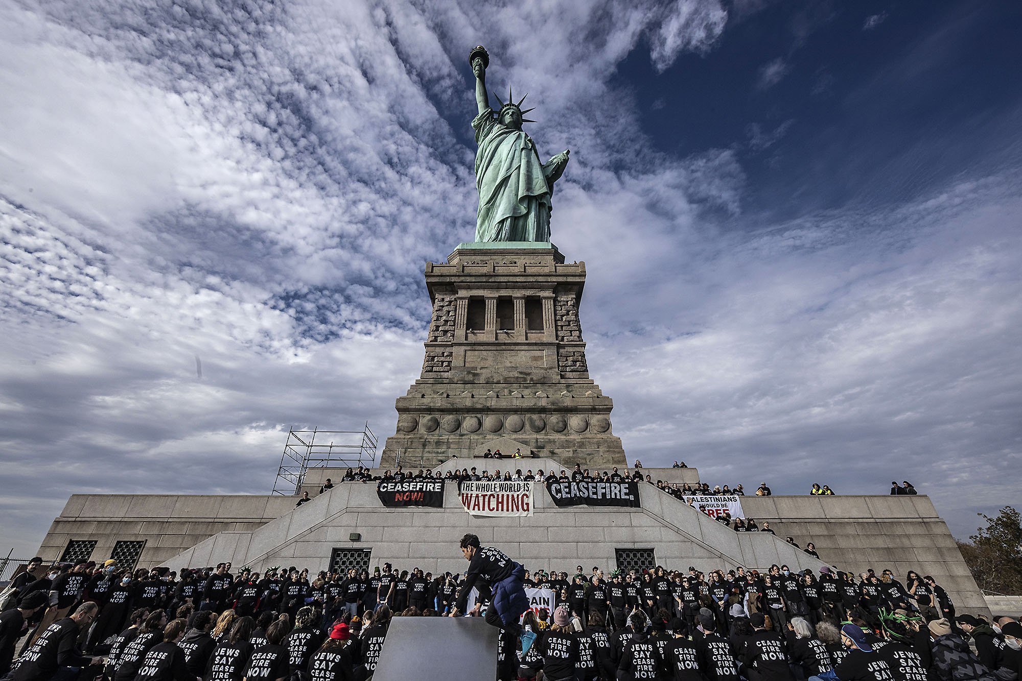  Pro-Palestinian activists demonstrate in front of the Statue of Liberty. New York, NY 