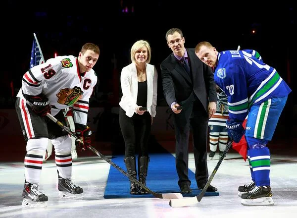 Jonathan Toews, Tessa Bonhomme, Scott Niedermayer and Henrik Sedin at Rogers Arena in Vancouver. 2014