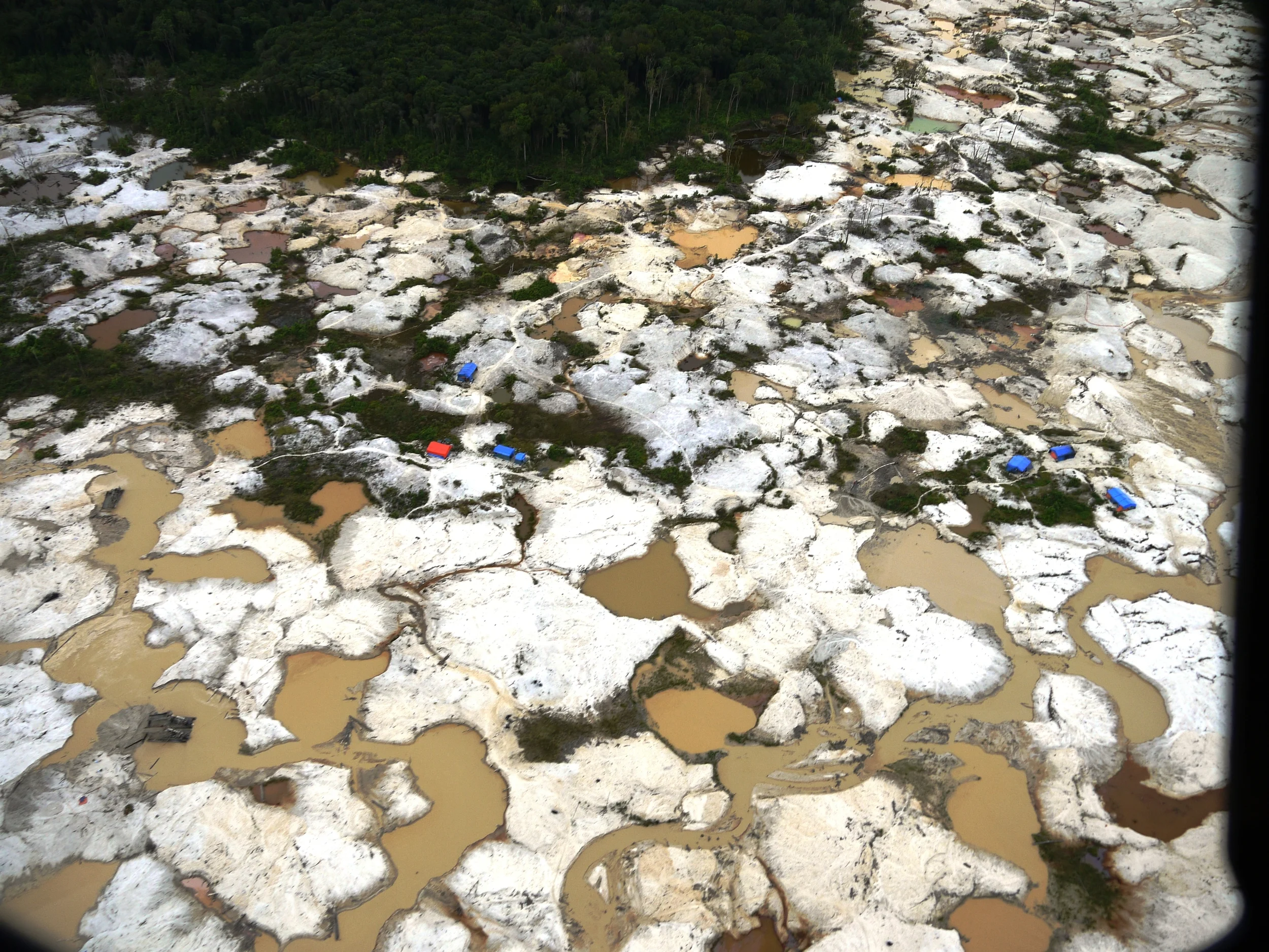 Moonscape... aftermath of illegal gold mining in Sumatra, Indonesia (photo by William Laurance )