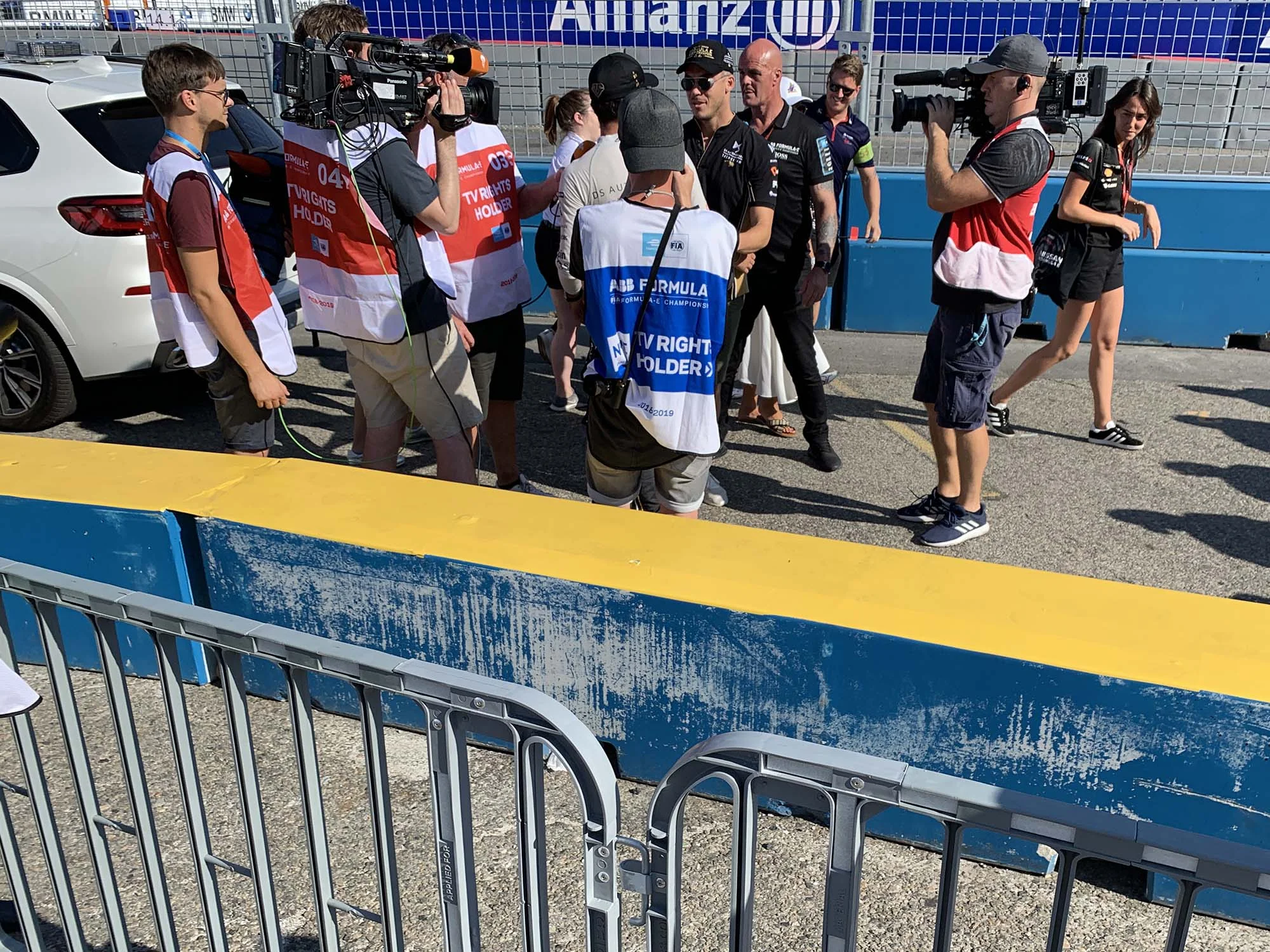 Vergne, in front of blue vest guy, is congratulated by fellow racer André Lotterer. Photo credit: me, being the worst event photographer ever by not looking at my phone while taking photo.
