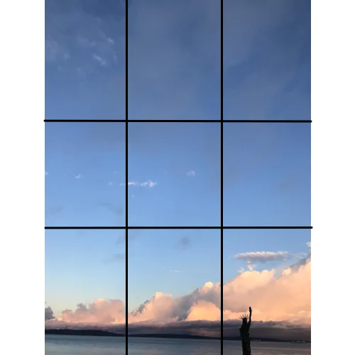 That’s because the key elements of the photo — the clouds, the mini-Statue of Liberty, the horizon line along the water—do not lie on a grid line or at grid-line intersections. Basically, there’s too much sky and it overwhelms the more interesting elements in the photograph.