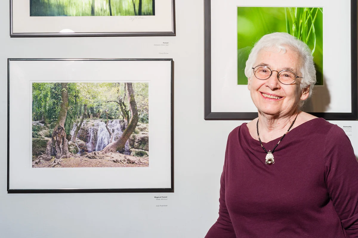 Judy Rosenblatt standing next to her work