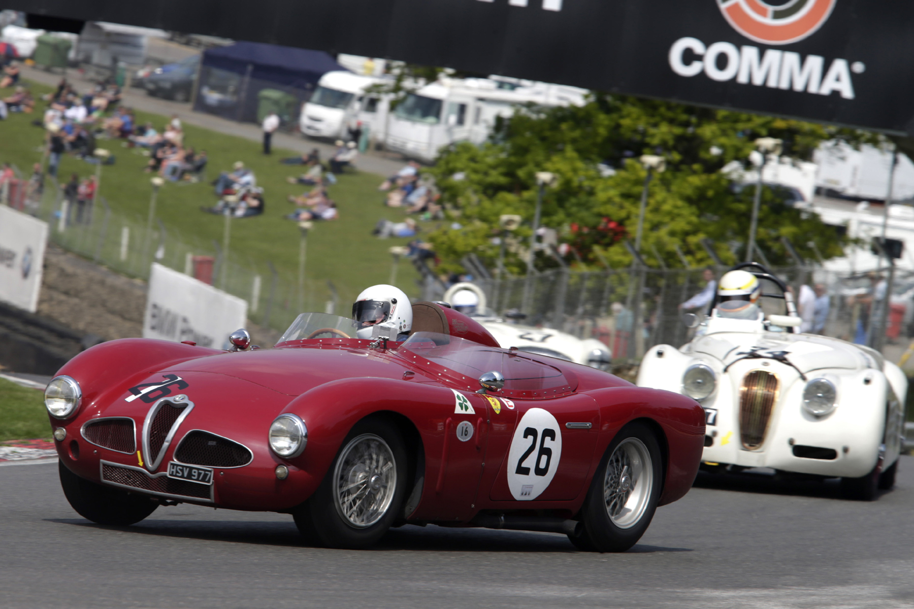 Christopher Mann's gorgeous Alfa Romeo Disco Volante rounds Druids chased by Christopher Scholey (XK120) and Nigel Grice (Austin Healey 100M) Photo - Gary Hawkins 
