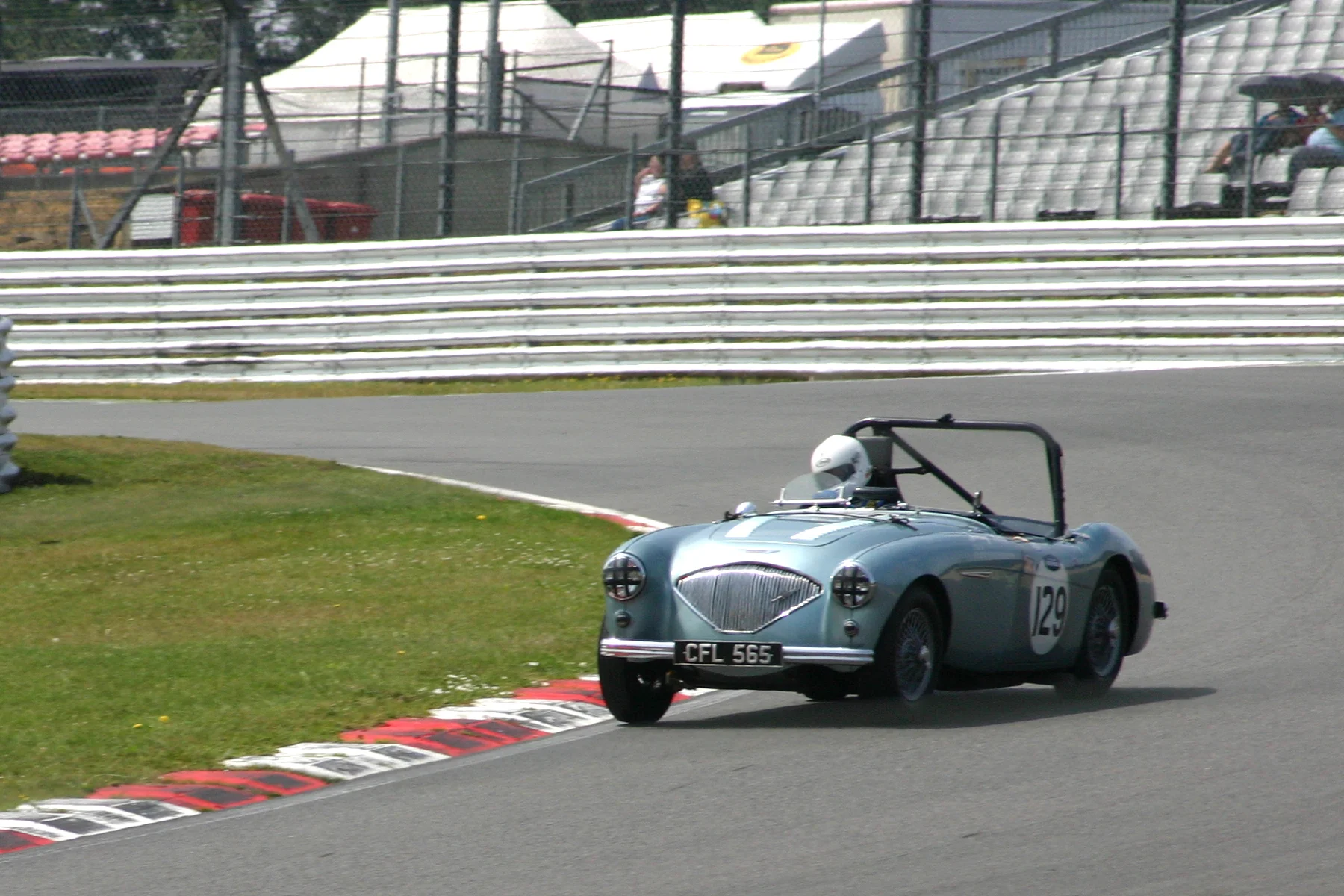 Neil Hardy drifts through Paddock Hill bend Photo - Jonathan Abecassis