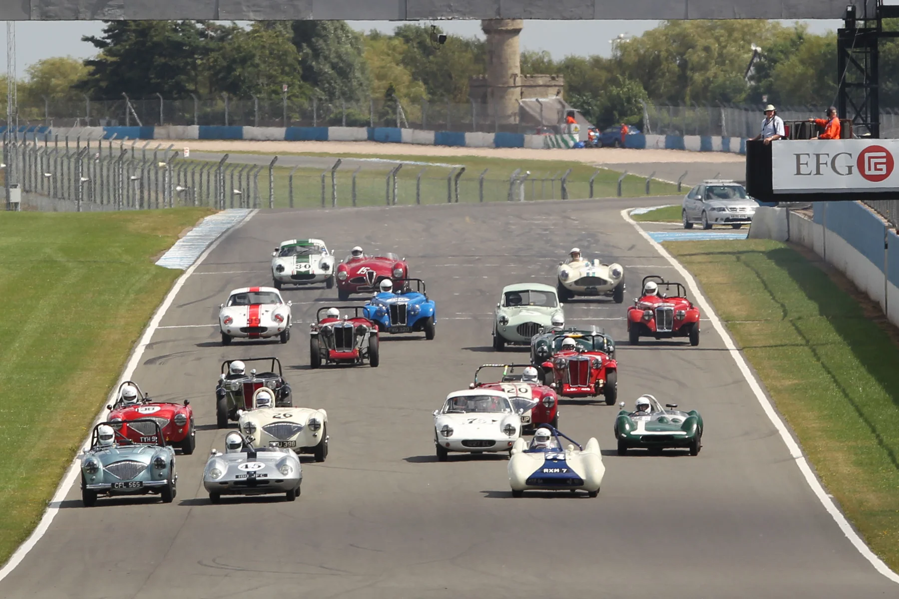 Getting off the line provided a rapid reshuffle with Hardy (Austin Healey - extreme left) making a superb start and Brian Arculus (Lotus IX) also coming through from the second row. Photo - Mick Walker 
