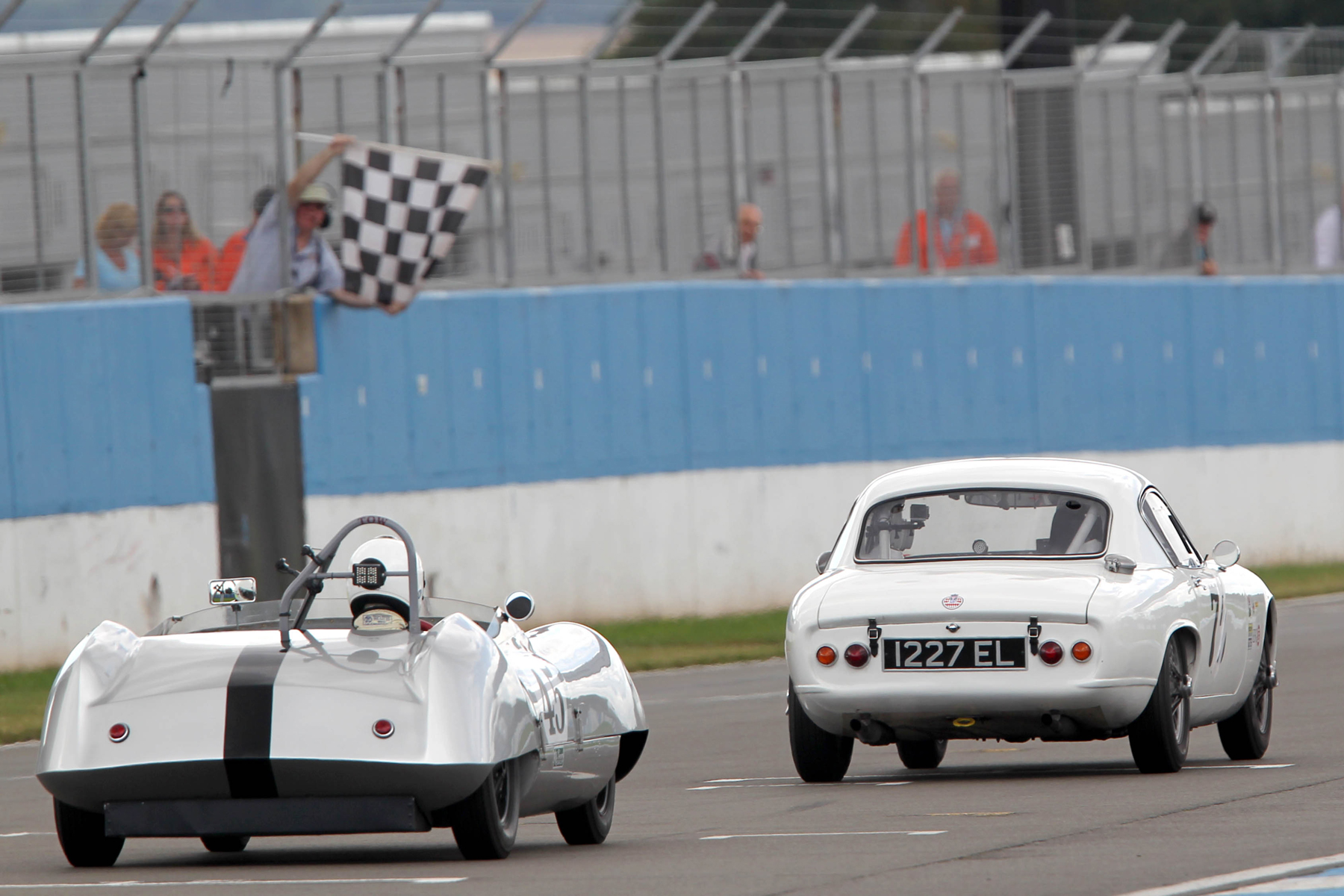 Rod Begbie got this close to Robin Ellis at the flag, a drive that earned him Driver of the Race from the commentators. Photo - Mick Walker