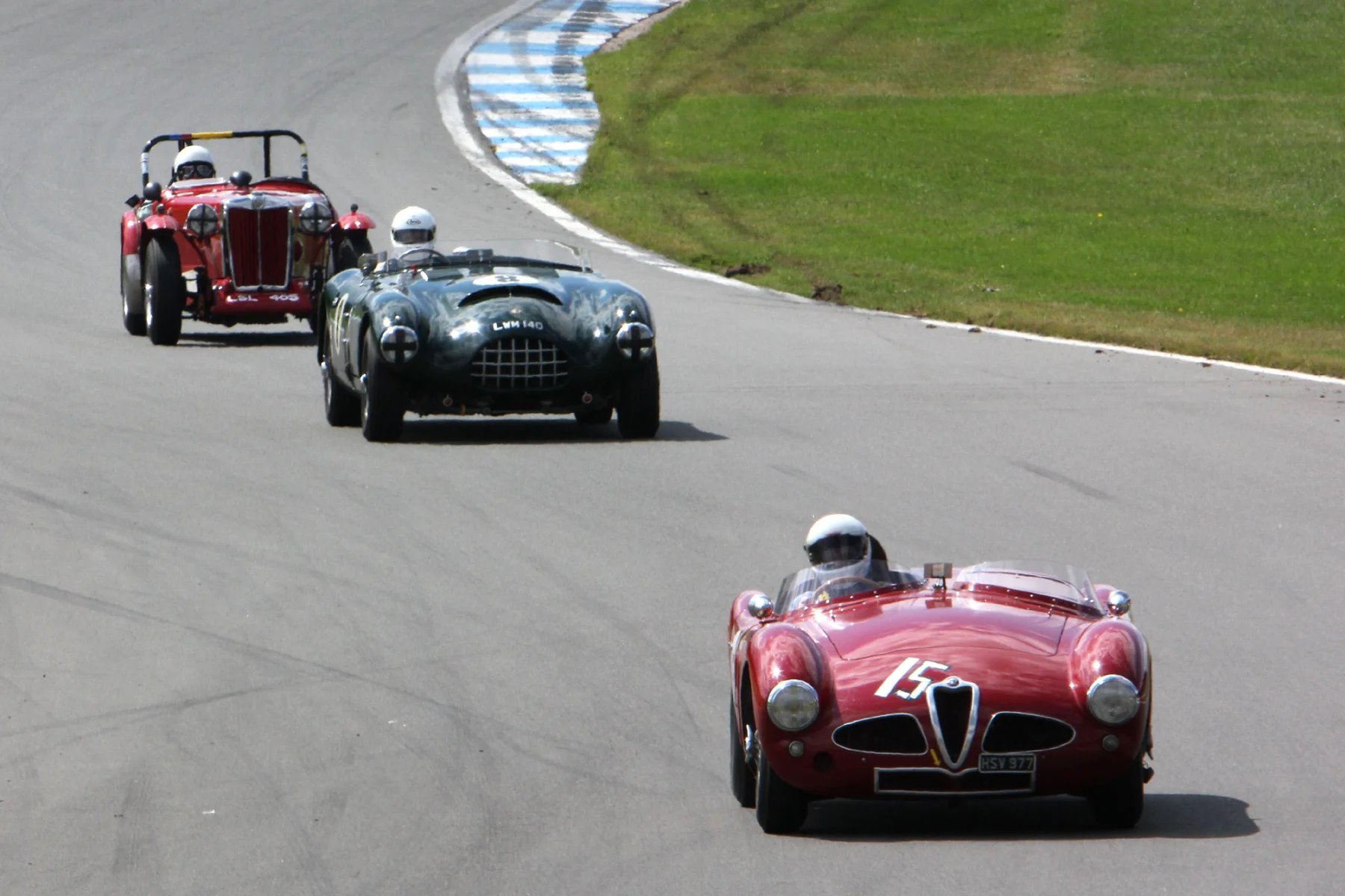 Chris Mann's Alfa Romeo Disco Volante heads the Gomm Jaguar Special and one of the MG 'T' Types Photo - Pat Arculus