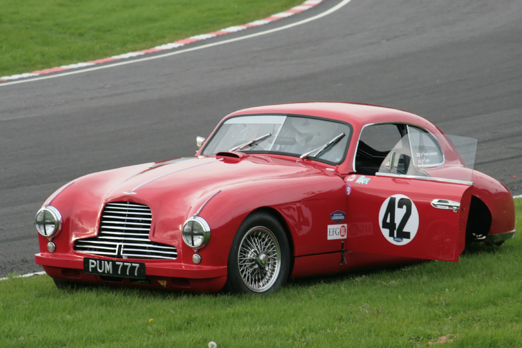 The Aston came to a halt on the outside of Quarry, not the best of places, but Paul is here in the process of emerging safely from the car. Photo - John Turner 