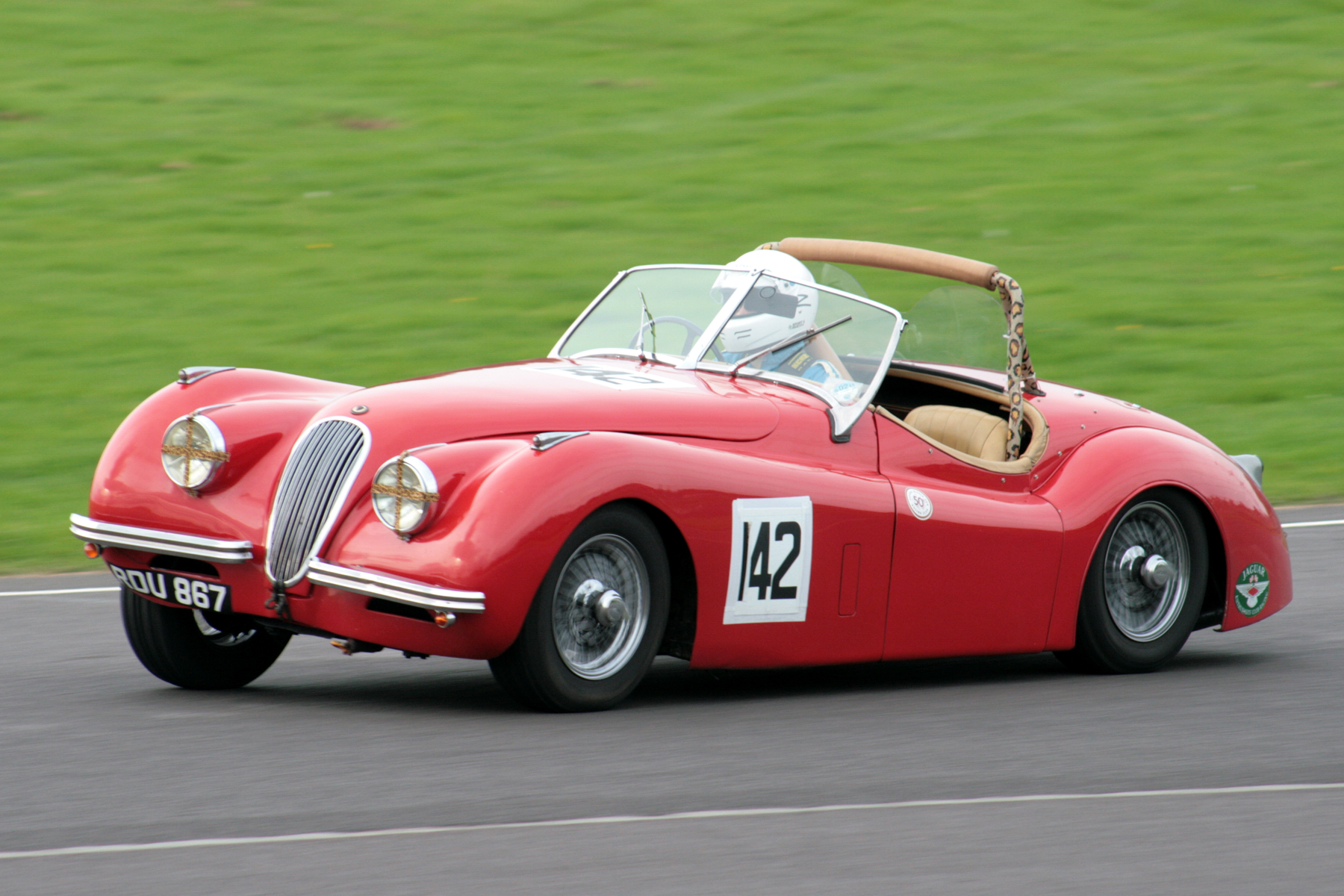Geoff Ottley displays the XK120's droopy rear end! Photo - John Turner