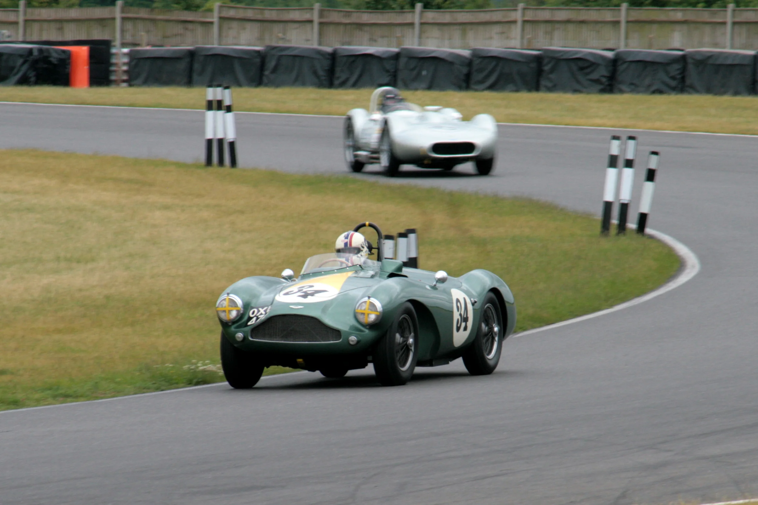 Steve Boultbee Brooks had the Inter-Marque race under control in his Aston Martin DB3s, over the chasing Stephen Bond in the Lister Bristol until the Aston slowed dramatically on the last lap and died completely in sight of the chequered flag as Bond swept by to win. However, in an action recalling an earlier heroic age of motor racing, Steve then pushed the Aston up the Senna Straight to finish 3rd, an action that earned for him the Motorsport News Spirit of the Day award. As a result of the Aston's last minute drama, Stephen Bond and Adam Singer (Kurtis 500s) won the team award as the 'Newcomers' team from 'The Italian Job' team of Chis Mann (Alfa Romeo Disco Volante) and Grahame Oakins (Alfa Guilia Sprint and 'The Lightweights' team comprising Jonathan Smare (Lotus Elite) and Mandie Hadfield (Elva Courier) photo - John Turner 