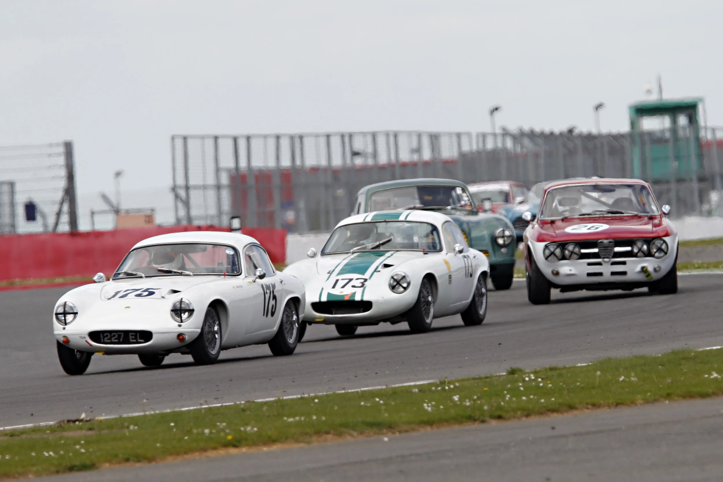 the Lotus elites of Robin Ellis and Jonathan Smare, the latter making a particularly good start got ahead of the sharp Aston early on. Photo - Mick Walker