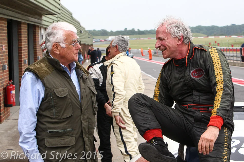 Grahame White, HSCC Race Director, greets Julian Majzub, as Roberto Giordaneli and Mark Lewis exchange race notes
