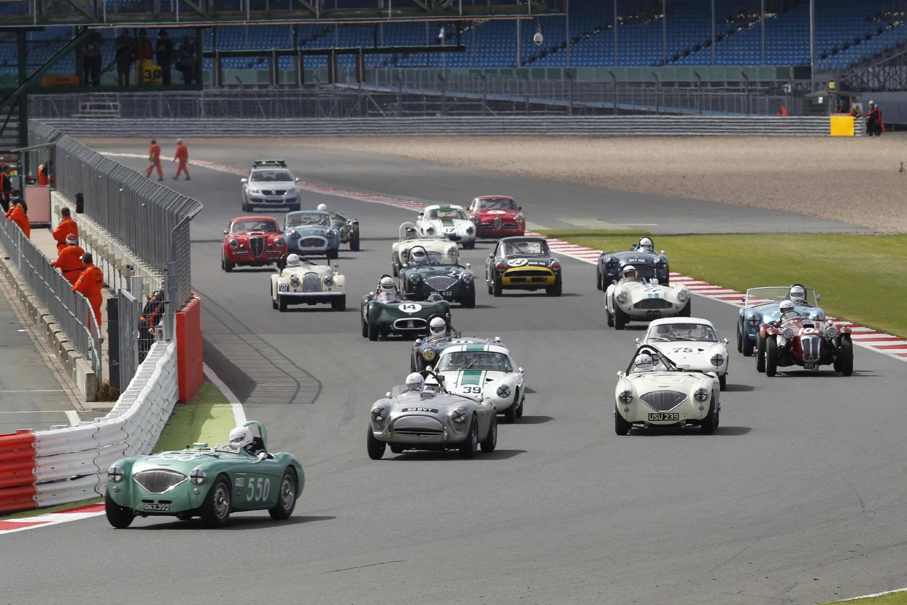 Martyn Corfield grabs an immediate lead. Note superb starts by both Graham robson (Austin Healey) and John Ure (10 far right), both starting from Row 5! Photo - Mick Walker 