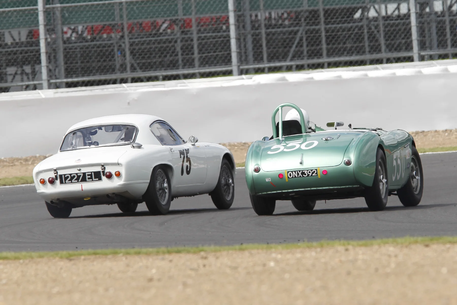 Robin Ellis about to complete his overtake for the lead, on the exit of Woodcote Photo - Mick Walker 