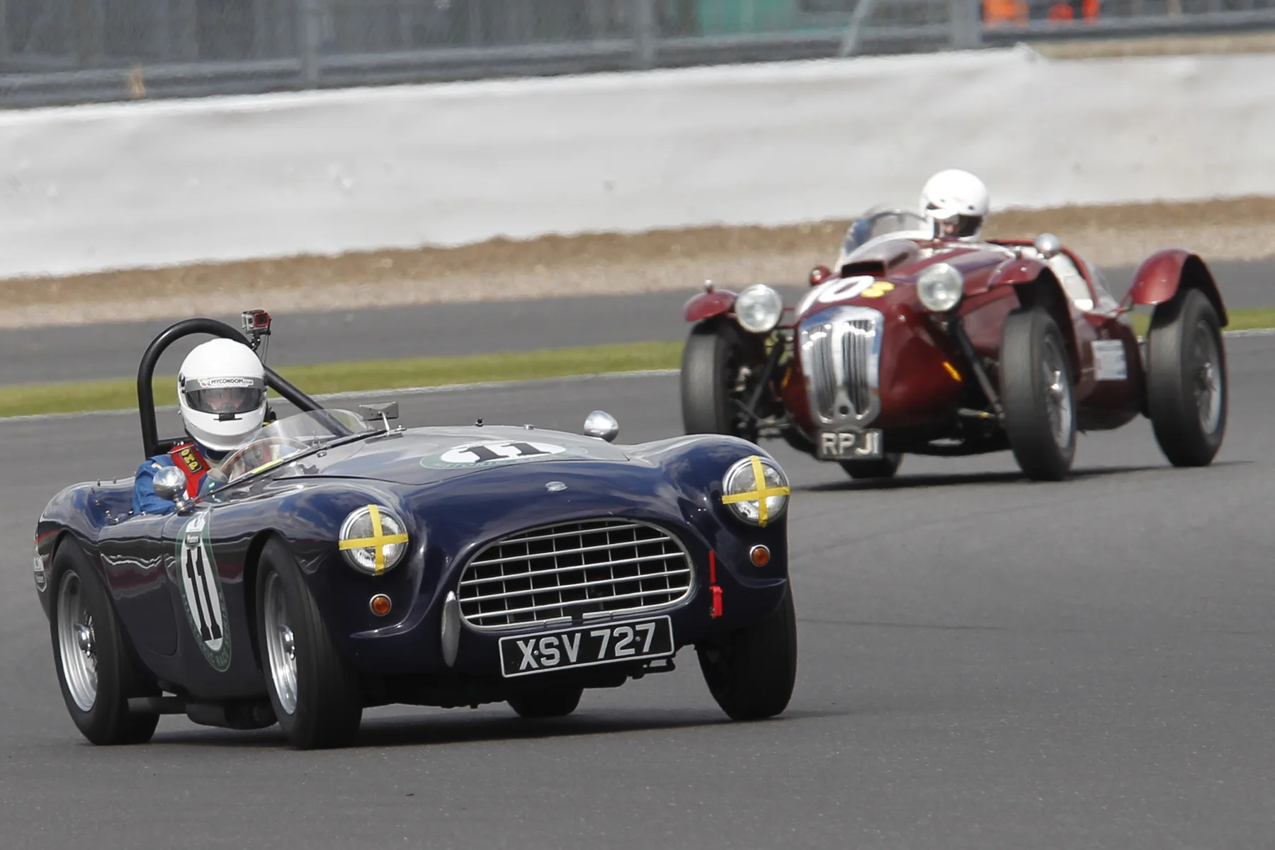 Ted Shepherd was first to take his pitsop. Here, on lap 6, he heads John Ure Photo - Mick Walker 