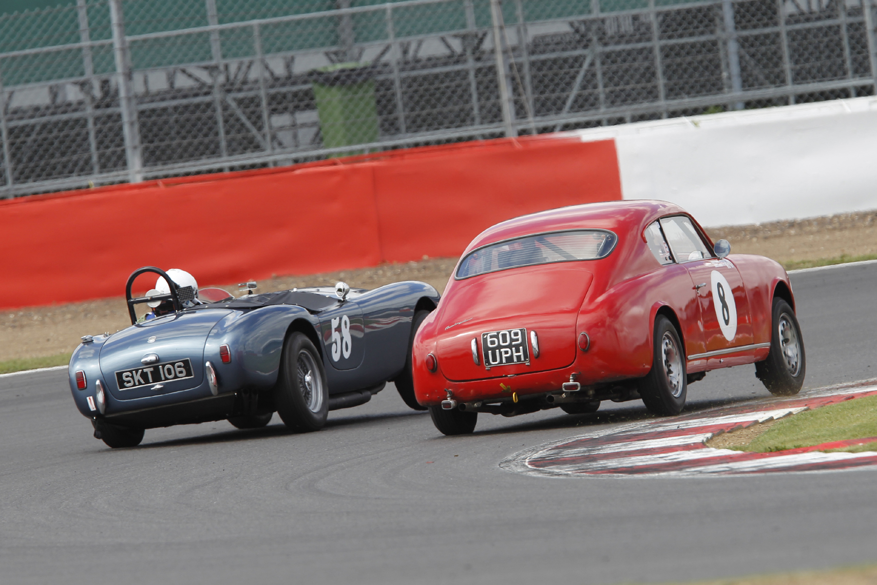 Synchronised leaning! Mark Morgan (AC Ace) and Jason Kennedy (Lancia Aurelia GT) 'slug it out' Photo - Mick Walker