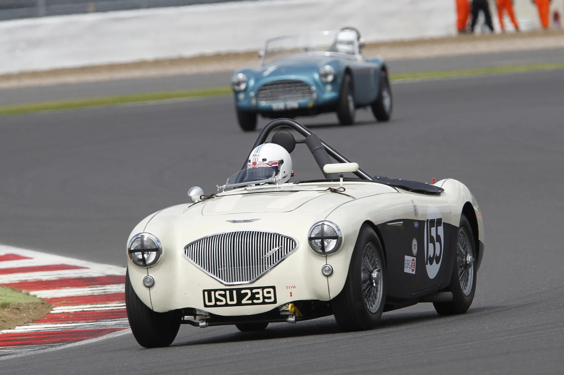 Graham Robson had a fine run to 5th. Here he is chased By David Cottingham but at the flag they were spilit by David Bennett's Aston Martin DB3S Photo - Mick Walker 