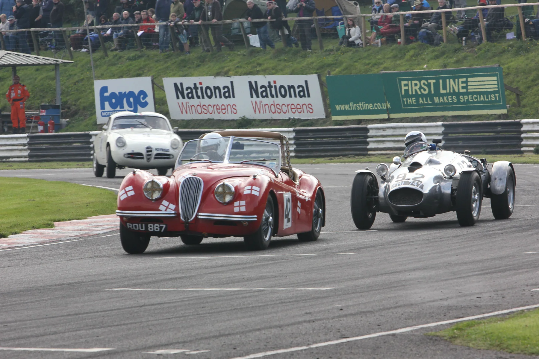 Geoff Ottley (XK120), Peter Campbell (Wingfield Bristol Special) and Brian Arculus (Alfa Romeo Guilietta SVZ) round Camp (last corner) at the end of lap 2. Photo - Pat Arculus, Tripos Media