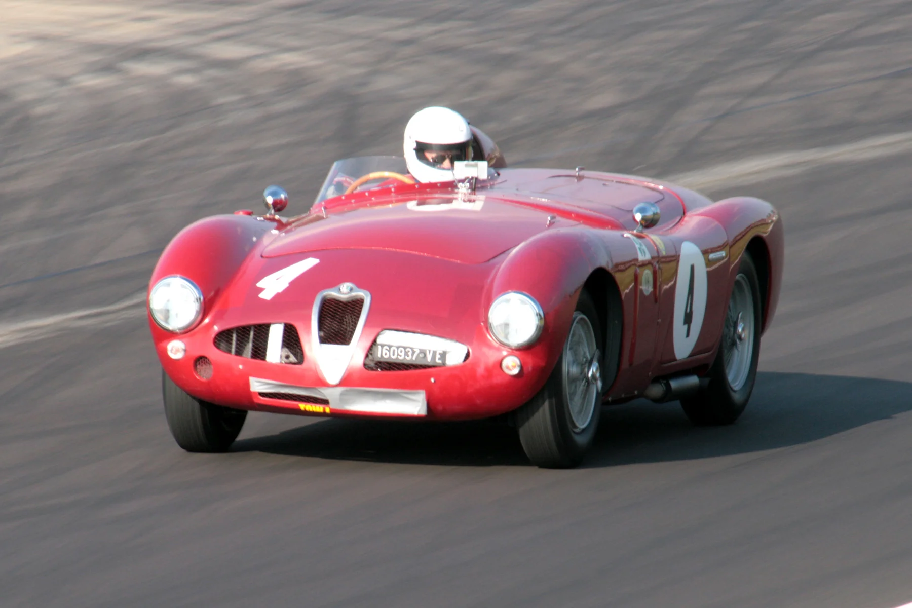 Still showing signs of its Goodwood Revival contretemps is the Alfa Romeo Disco Volante of Chris Mann. It looks as though Chris is looking down into the cockpit rather than at his mirror! He finished 24th. Photo - John Turner