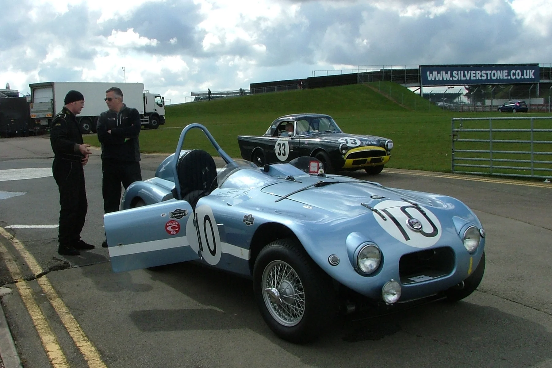 Awaiting practice! Sam Stretton extolls the virtues of the 1952 Nash Healey that finished 3rd at Le Mans in 1952, to our sponsor, Paul Woolmer. Behind, Keith Hampson sits quietly in his Sunbeam Alpine Le Mans. Photos - John Turner 