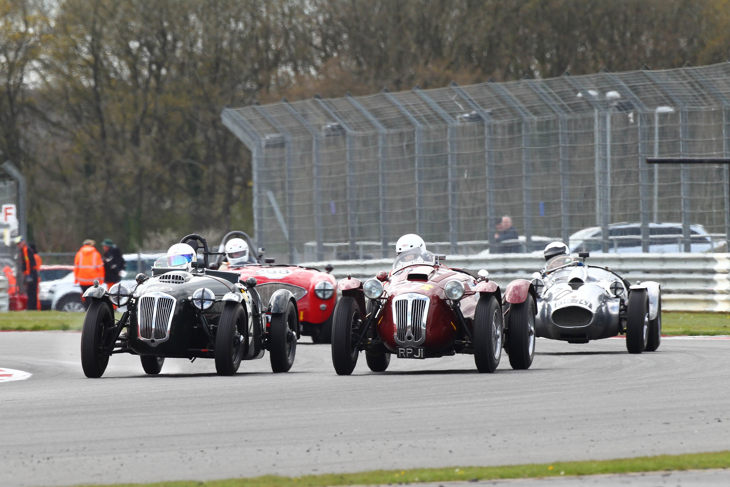 Ian Dalglish on the inside, John Ure on the outside both in Frazer Nash Le Mans Replicas whilst Peter Campbell (Wingfield Bristol) and Nick Matthews (Austin Healey) maintain a close watching brief. Photo - Richard Styles