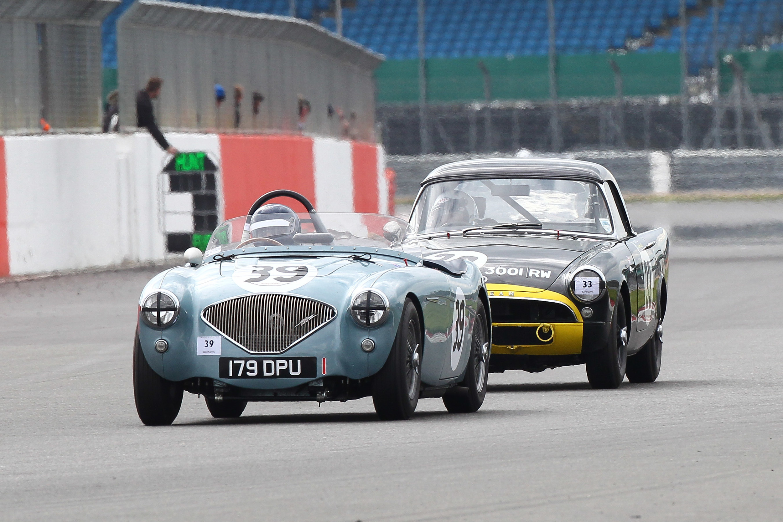 Superb dice between Robert Clarke (Austin Healey 100/4) and Keith Hampson (Sunbeam Alpine Le Mans) went to the flag Photo - Richard Styles