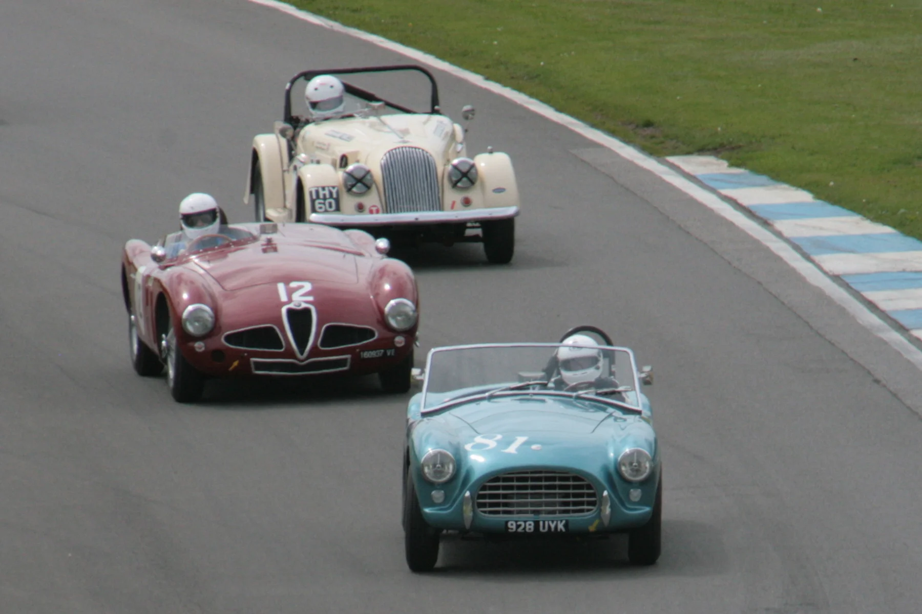 David Cottingham (AC Ace), Christopher Mann (Alfa Romeo Disco Volante) & Richard Thorne (Morgan +4) at the bottom of the Craner Curves about to turn into the Old Hairpin on the first lap. Photo - John Turner 