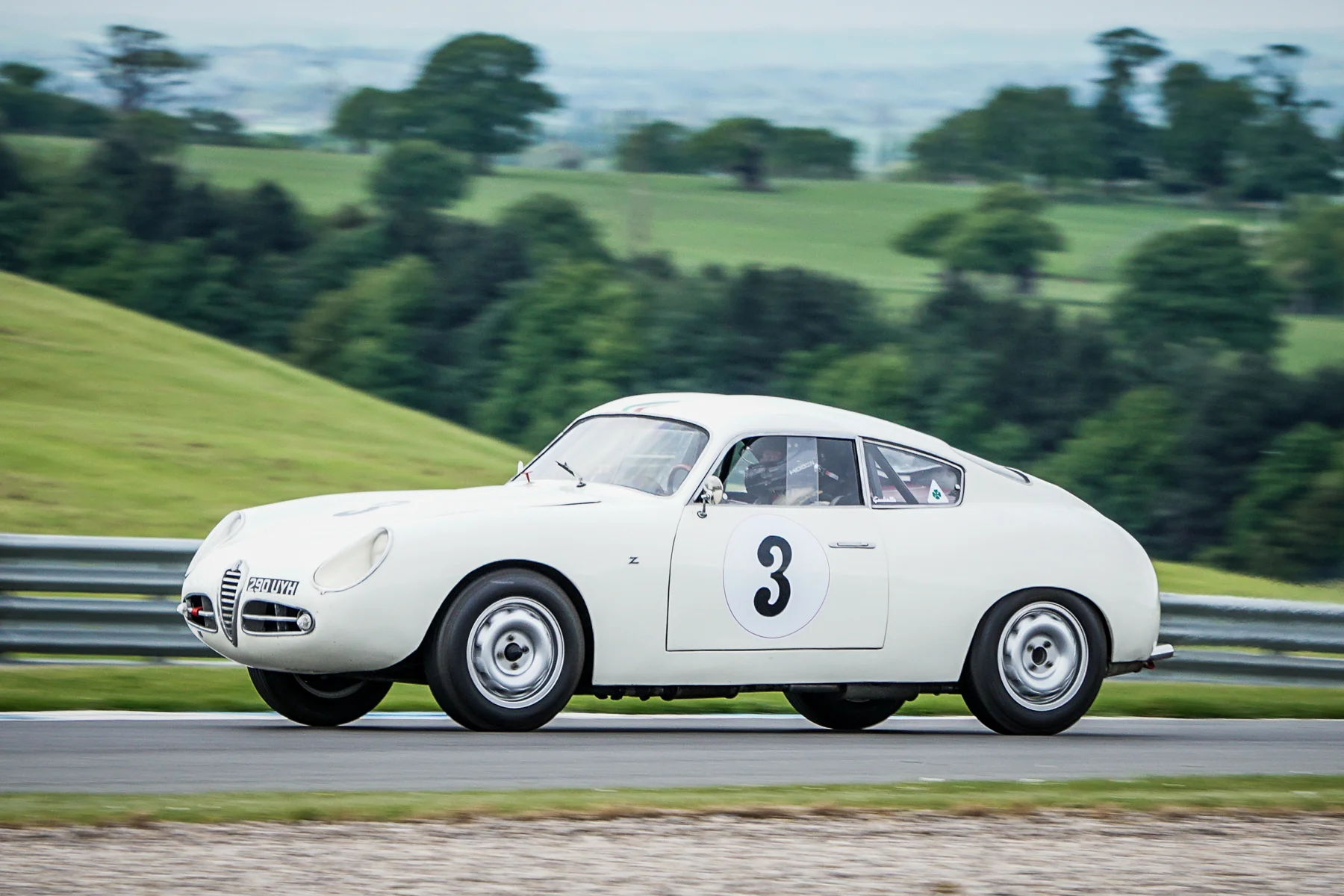 Brian Arculus presses on in the Alfa Romeo Giulietta SVZ to take 4th place after an early race tussle with Mark Hoble's TR2 Photo - Chris Dicken, Tripos Media