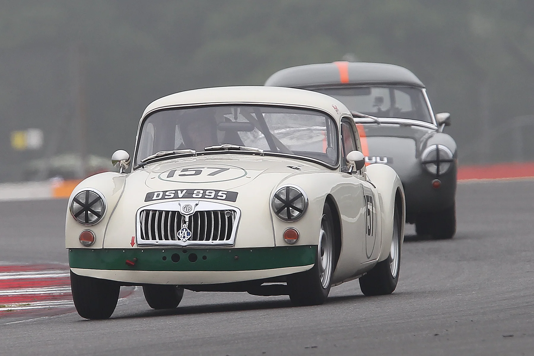 Simon Gurney's lovely MGA Coupe, our Class 4 winner leads the non FISCAR compliant but very pretty Sprite Mk 1 of Jim Mackie. Photo - Mick Walker