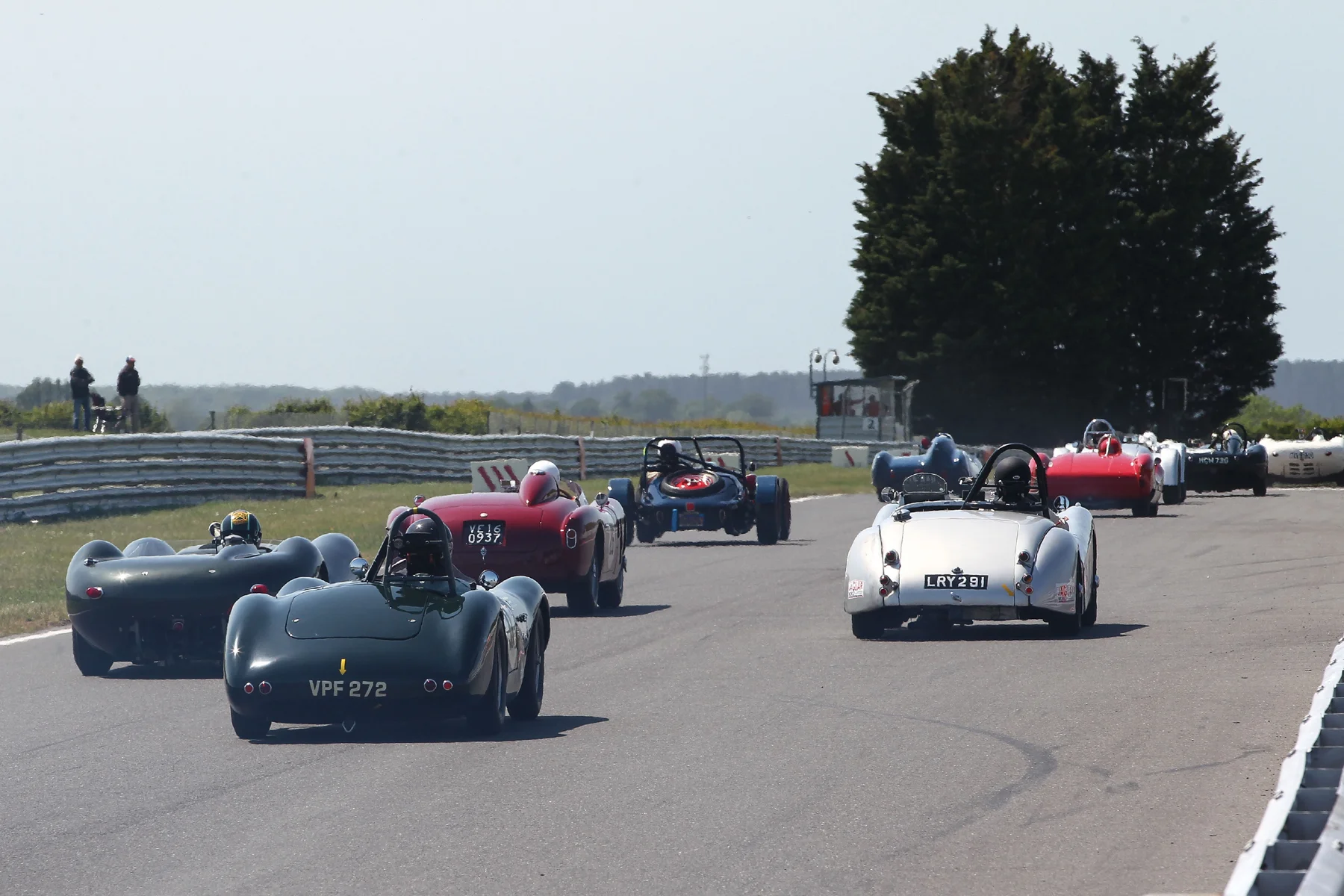 The rise from the startline is evident here as the cars head towards Riches. At the back is Paul Griffin's lovely ex Archie Scott Brown Connaught ALSR. To his left is Richard Last's Lister Jaguar. Ahead, is Chris Mann's Alfa Romeo Disco Volante alongside Andrew Wenman's Jaguar XK120 with the very stark rear end of Rob Manson's Baldwin Mercury Special from 1949 and therefore the oldest car in the race, ahead. Photo - Richard Styles