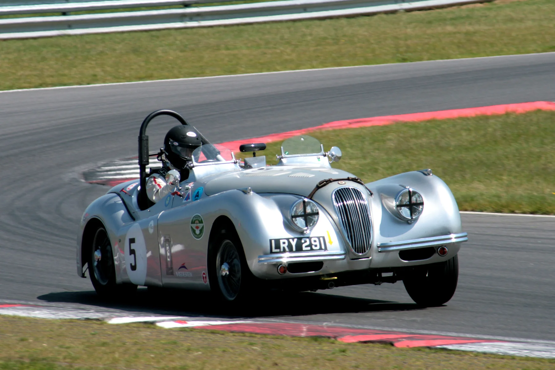 Andrew Wenman exits Murrays in his Jaguar XK 120 Photo - John Turner 