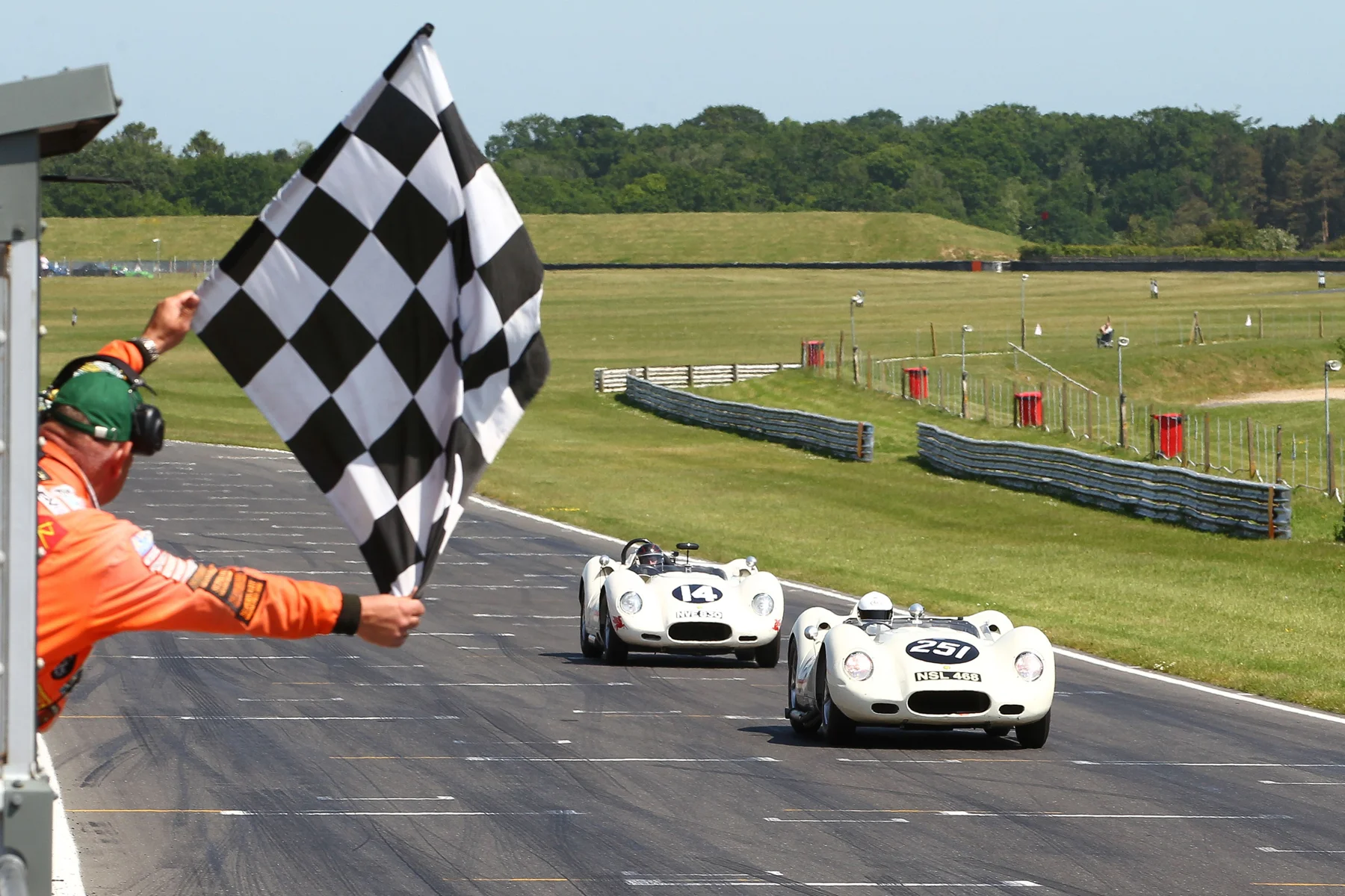 Mark Lewis takes the flag just ahead of Roberto Giordanelli Photo - Richard Styles