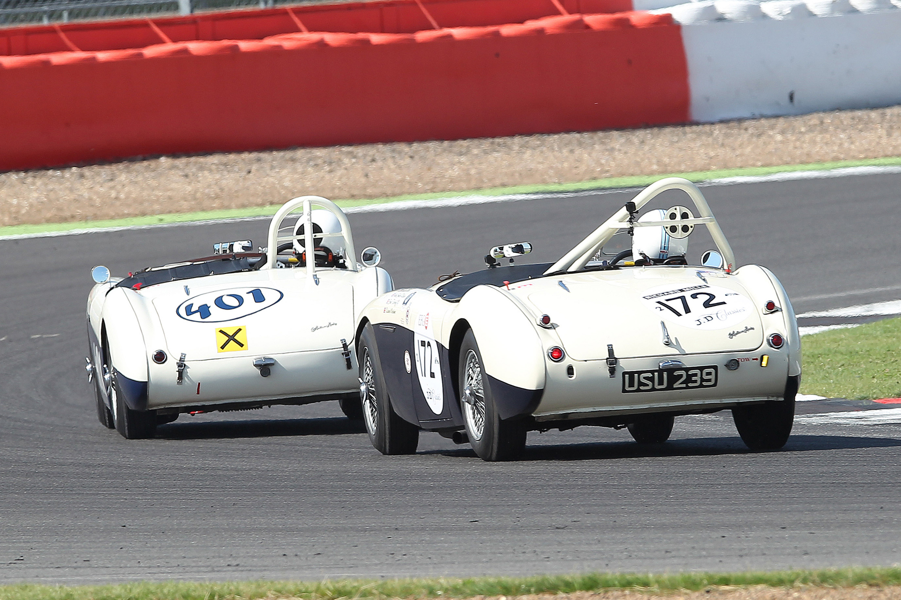 Jason Harris (Austin Healey 100/4) leads Graham Robson (Austin Healey 100M) in their great dice. Photo - Mick Walker