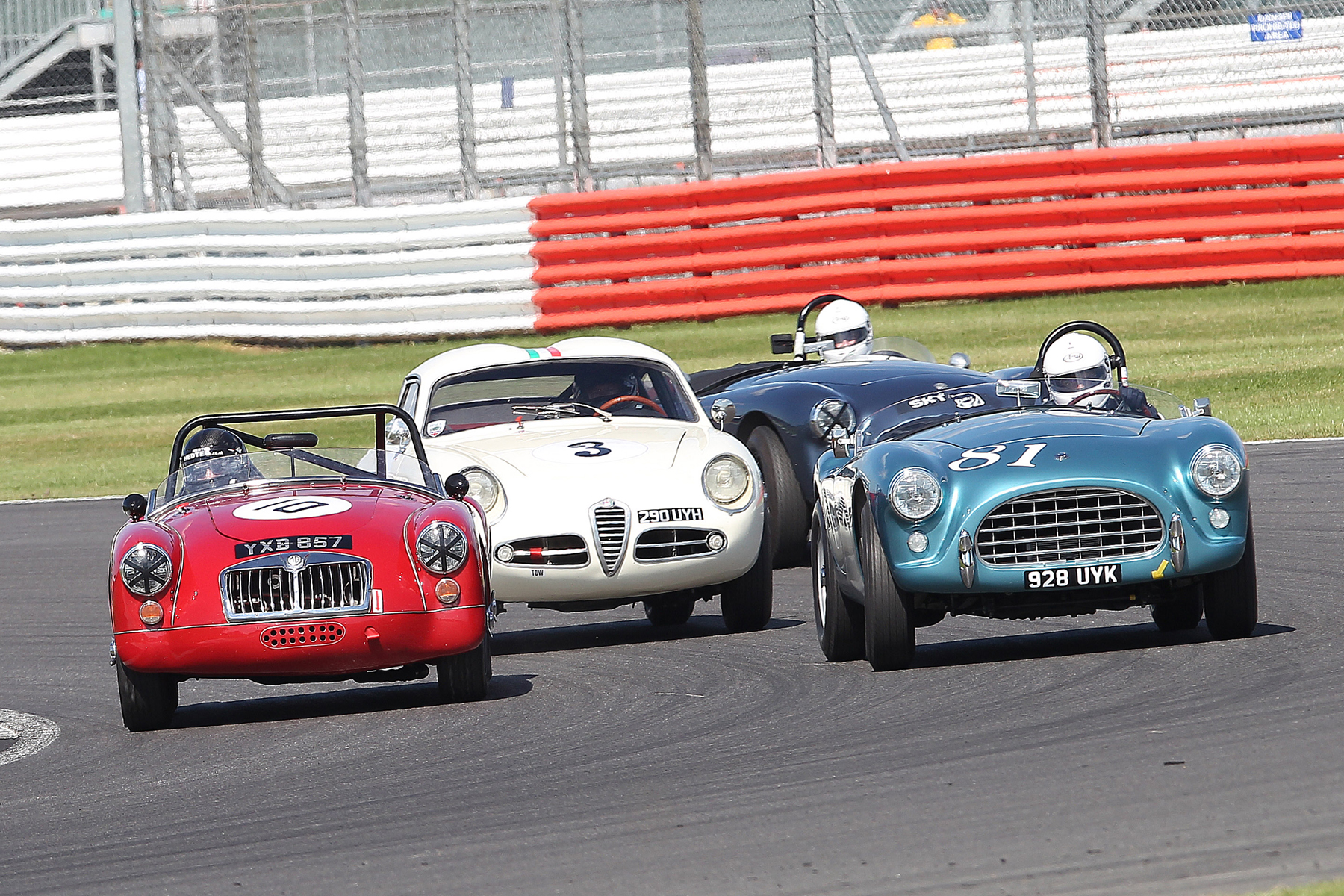 Terry Bryant keeps tucked in tight as the battling David Cottingham, Brian Arculus and Mark Morgan pass on the outside into Luffield Photo - Mick Walker 