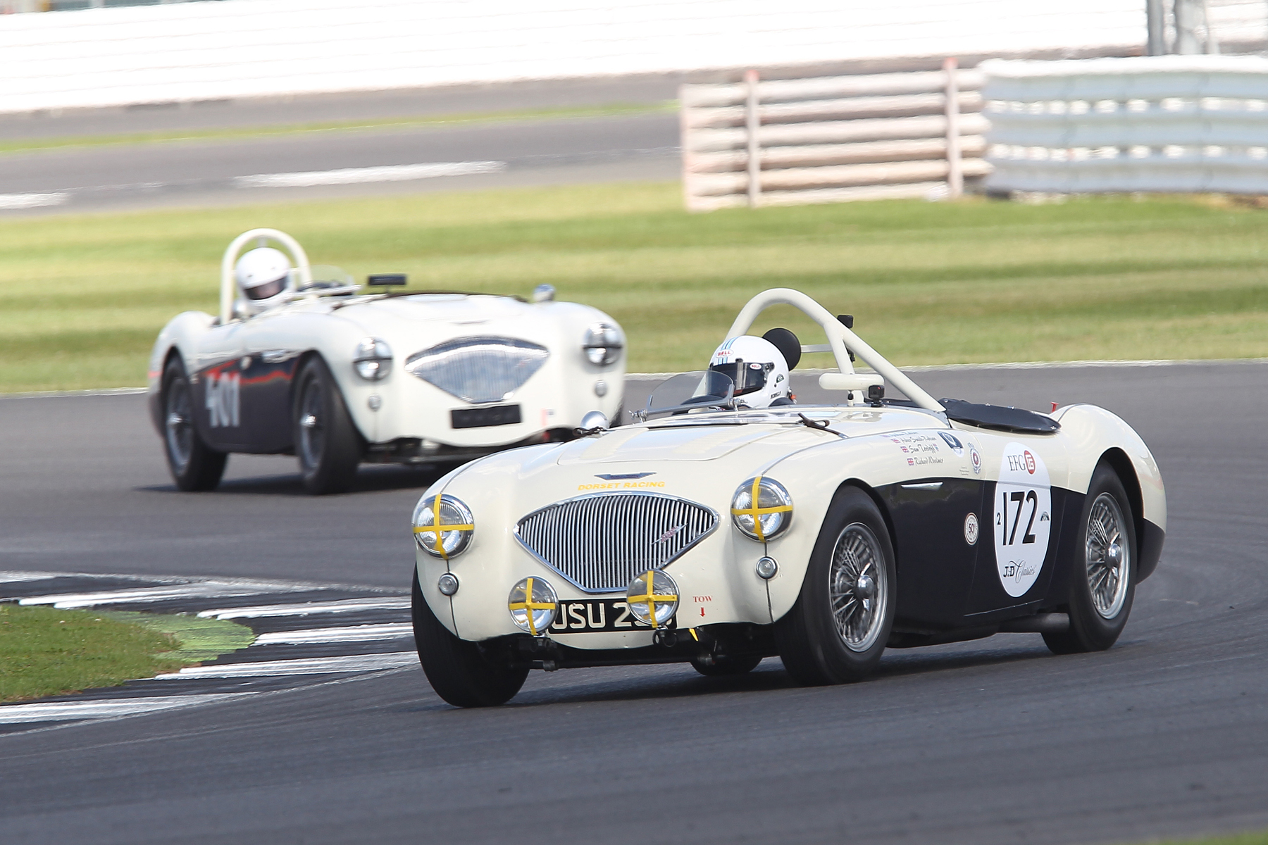 Graham Robson's Austin Healey 100M chose to eat rubber rather than burn it! Just ahead out of shot is Jim Campbell's 100/4 and just behind (401) Jason Harris's similar model. Photo - Mick Walker