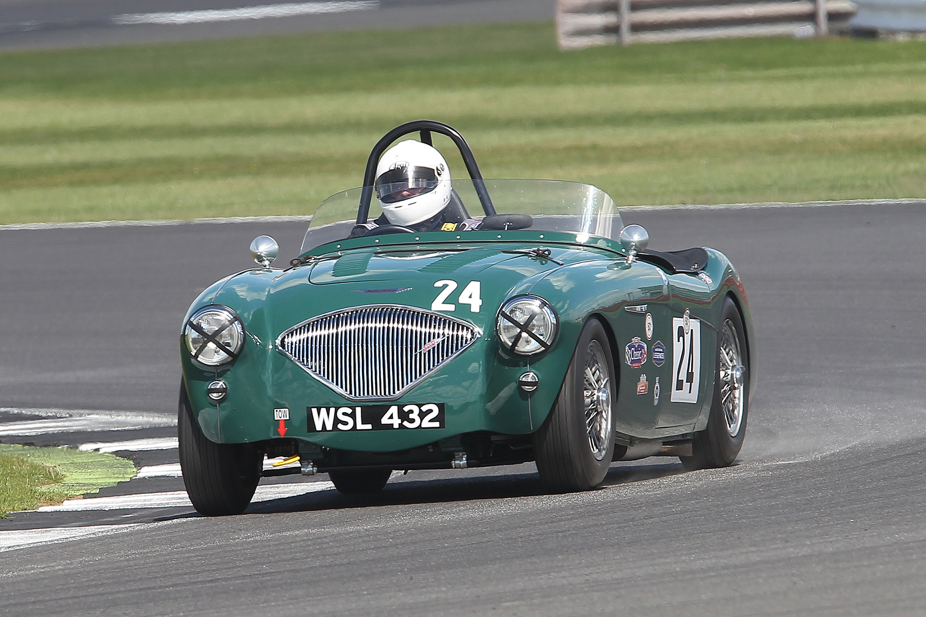 Elegant car; elegant driver. Another fine portrait of Jim Campbell's 100/4. Photo - Mick Walker
