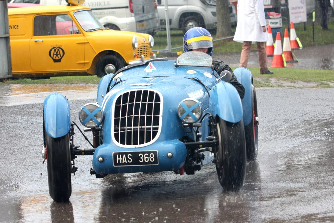 Sam Stretton, in the Alta also negotiating the paddock area in delightful conditions! Photo- Pat Arculus, Tripos Media