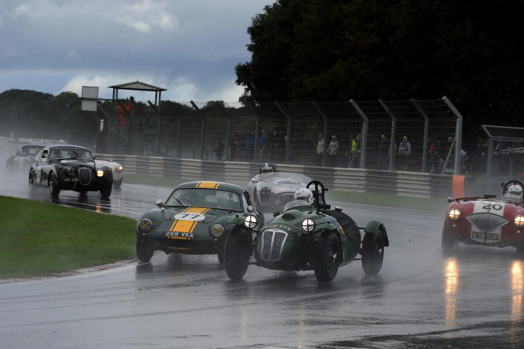 Into Quarry for the first time, the first 4 have already gone through. A good start from Mike Freeman in the Lotus Elite allows him to try to slip up the inside of Patrick Blakeney Edwards in Martin Hunt's Frazer Nash, but he failed to complete the move as Patrick put the power down first. On a wide line is Jonathan Abecassis in his Austin Healey, whilst watching them closely is Kevin Kivlochan in the first of the AC Aces. Saving his battery is Marc Gordon in his Jaguar XK150! Photo - Jeff Bloxham
